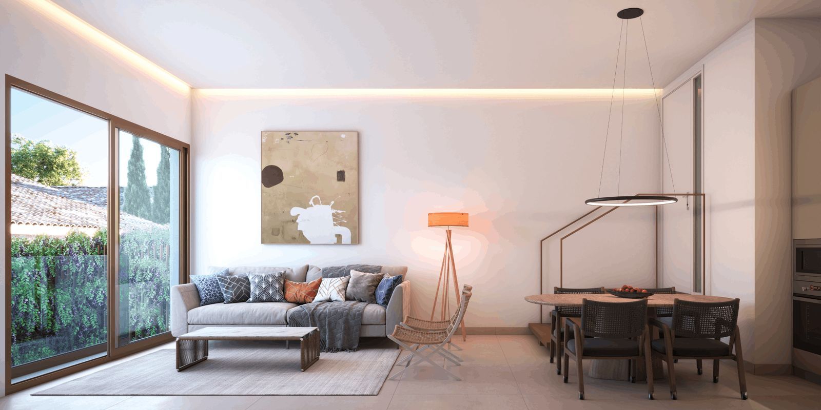 Lichte woonkamer met eethoek en uitzicht op de tuin